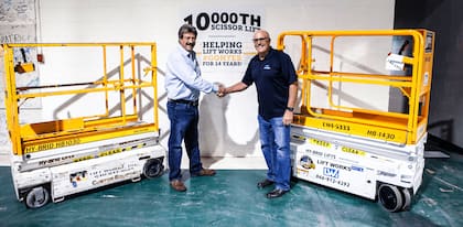 Steve Kissinger and Marvin Starck celebrate Hy-Brid Lift's 10000th lift